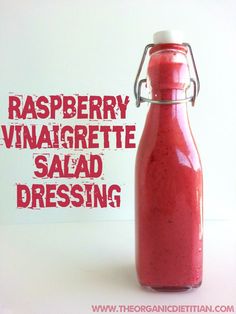 raspberry vinaigrette salad dressing in a bottle with the words raspberry vinaigrette salad dressing