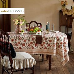 a table with flowers and candles on it in the middle of a dining room area