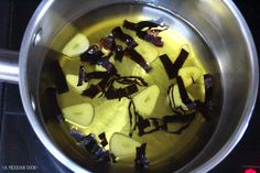 the food is being prepared in the pot on the stove