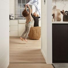 two children jumping up in the air