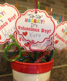 valentine's day cookies in a cup with candy sticks sticking out of the top