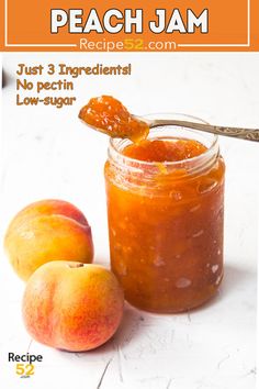 peach jam recipe in a jar with two peaches next to it on a white table