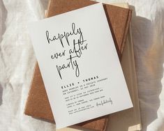 an open book on top of a white sheet with the words happily ever after party written on it