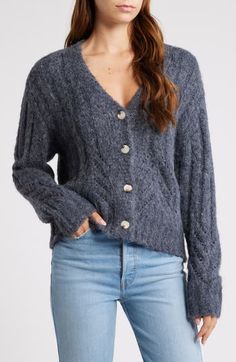 A mix of ribbed, pointelle and cable stitching provides cozy texture to this V-neck cardigan that's an essential for sweater season. 23" length (size Medium) Front button closure V-neck Long sleeves 55% polyester, 40% nylon, 5% wool Dry clean Imported Cozy Texture, Sweater Season, Cable Stitch, V Neck Cardigan, Midnight Blue, Sweater Top, Stitching, Cable, Dry Clean