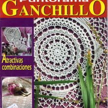 the front cover of a magazine with crocheted dois and flowers on it