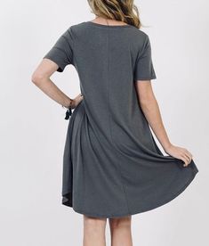 Look elegant and feel comfortable in this charcoal gray pocket midi dress for Women. Crafted with stretch fabric and a roomy fit, you'll love this luxuriously soft dress. With a casual and cute silhouette, it is perfect for wearing with leggings for a stylish, yet comfortable, look. And, with a convenient phone pocket, you can stay connected wherever you go! Order Today! Gray Midi Dress Details: Small Dress: 32" chest, 33" length Medium Dress: 34" chest, 33" length Large Dress: 36" chest, 33" le Shift Dresses For Women, Tops For Women Long, Pocket Dresses, Midi Dress For Women, Mom And Me, Casual Short Sleeve Dress, Cozy Fall Outfits, Short Sleeve Shift Dress, Grey Midi Dress