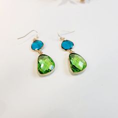 Step into summer with these pretty Blue and Green Olivestone Dangle Drop Pendant Earrings! Perfect for adding a touch of glam to any outfit, these earrings are designed to be both stylish and different, ensuring you stand out with their unique, colourful charm. Visit the Jazzi J shop for more items - https://jazzijbykaren.etsy.com Key Features: * Pretty Design: The beautiful combination of blue and green olivestones creates a captivating look that is perfect for any occasion. * Glamorous Appeal: Green Teardrop Jewelry For Summer, Trendy Blue Dangle Teardrop Earrings, Elegant Turquoise Earrings For Summer, Trendy Blue Teardrop Earrings Gift, Trendy Blue Teardrop Earrings For Gift, Green Drop Earrings With Gemstone Accents, Trendy Blue Teardrop Earrings For Gifting, Summer Crystal Drop Earrings Gift, Summer Gift Crystal Drop Earrings