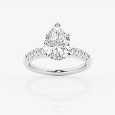 a pear shaped diamond ring on a white background