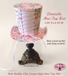 the pink shabby chic style mini top hat is on display