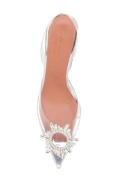 Like something out of a modern fairy tale, this glassy, pointy-toe slingback is glammed up with a bejeweled brooch inspired by an art deco sunburst mirror. The signature flared heel has the look of a stiletto but is more comfortable and stable to walk on. 3 1/4" (83mm) heel (size 38.5) Synthetic upper/leather lining/leather and rubber sole Made in Italy Designer Shoes Glamorous Slingback Pumps For Cocktail, Clear Slingback Heels For Formal Occasions, Formal Clear Slingback Heels, Designer Clear Heels For Evening, Art Deco Sunburst, Amina Muaddi Begum, Modern Fairy, Modern Fairytale, Sunburst Mirror