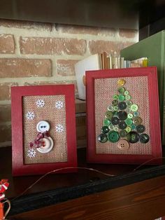 two framed christmas cards with buttons on them