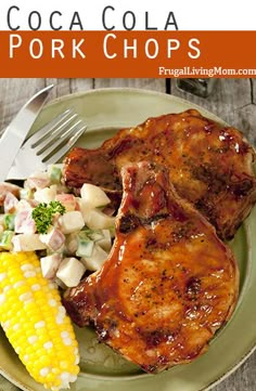 a plate with meat, corn and coleslaw on it next to a fork