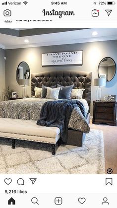 an instagram photo of a bedroom with grey walls and white rugs on the floor