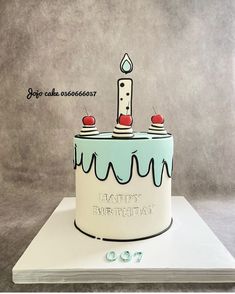 a birthday cake with candles and cherries sitting on top of a white card board