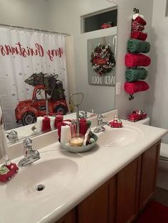 a bathroom decorated for christmas with red and green decorations