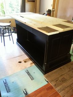 a kitchen island being built in the middle of a room