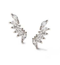 Perfect for those who love a little bit of offbeat styling, these wing shape floater earrings feature exceptional pavé crystals. Style with modern waves and layered necklaces. .925 Sterling Silver Cubic Zirconia pave crystals Hypoallergenic post Length: 0.5in (1.3cm) x Width: 0.15in (3mm) #E415 Necklaces 925, Silver Crystal Earrings, Silver Ear Climbers, Ear Climbers Earrings, Crawlers Earrings, Sapphire Studs, Climber Earrings, Wing Earrings, Crystal Earrings