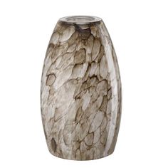 the vase is made out of marble and has an interesting pattern on it's surface