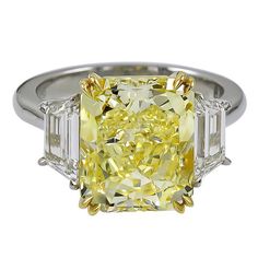 Magnificent engagement ring from ISSAC NUSSBAUM NEW YORK. This beautiful elongated Radiant cut fancy yellow diamond is flanked by two colorless stones. The Magic is in the cut! This stone is special and rare given that its Elongated radiant cut. the stone also appears far larger and higher color saturation than its certificate would suggest. Elongated Radiant Cut, Elongated Radiant, Dig Jewelry, Asscher Cut Diamond Ring, Radiant Cut Diamond Engagement Rings, Asscher Cut Engagement Rings, Diamond Rings With Price, Emerald Cut Diamond Engagement, Emerald Cut Diamond Ring