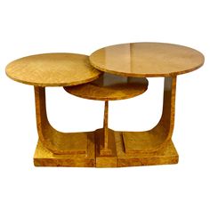 two wooden tables sitting on top of each other