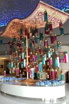 an elaborately decorated ceiling in the lobby of a building with chandeliers hanging from it's ceiling