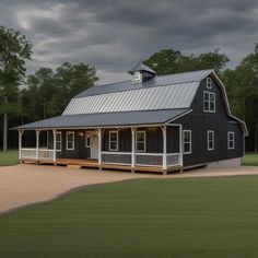 a black and white barn style house with a covered porch