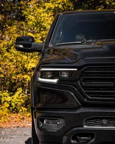 the front end of a black ram truck