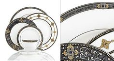 a white and black dinner set with gold accents