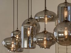 a chandelier hanging over a dining room table