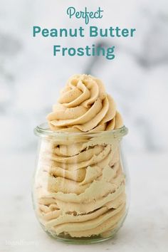 a glass jar filled with peanut butter frosting