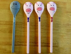 three spoons with cartoon animals on them