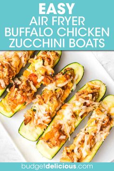 an easy air fryer buffalo chicken zucchini boats on a white platter