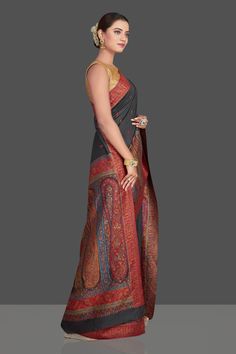 Alluring black tussar silk sari with multicolor Kani weave is a stunning choice for festivals and special occasions! It comes with a matching blouse piece. Shop silk sarees in USA from Pure Elegance. Disclaimer: The shown stitched blouse on the model is for display purpose only. The saree comes with a matching blouse piece and finished with fall and piko. The actual product may vary slightly from the image. These are custom orders, hence expect slight variation in color, placement of the motif or buta. ESTIMATED DELIVERYBecause this is a custom order, it would take about 4 weeks from the date of purchase. RETURN POLICYThis product is a custom order and cannot be returned or exchanged Fashion Journals, Indian Saree, Tussar Silk Saree, Traditional Fabric, Silk Sari, Silk Sarees Online, Indian Sarees, Sarees Online, Blouse Dress