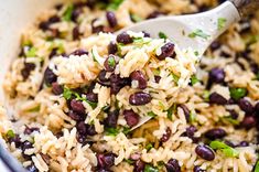 rice and beans are mixed together in a pot