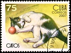 a postage stamp with a cat playing with a ball