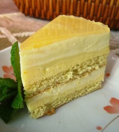 a piece of cake sitting on top of a white plate next to a straw basket