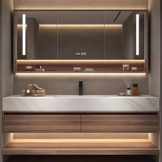 a bathroom with a sink, mirror and lights on the wall above it's counter