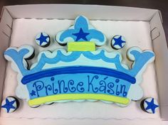 a decorated cake in the shape of a princess's tiara with blue stars