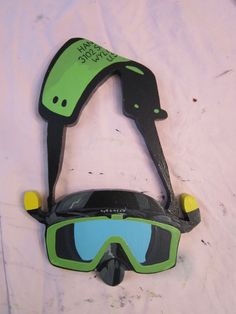 a pair of ski goggles on top of a bed