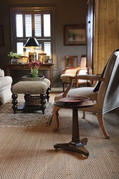 a living room filled with furniture and lots of windows