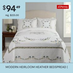 an advertisement for modern heir bedspread in white with blue flowers on the border