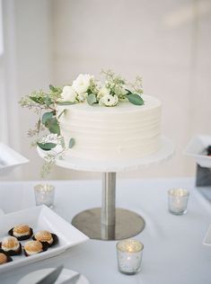 a white cake sitting on top of a table