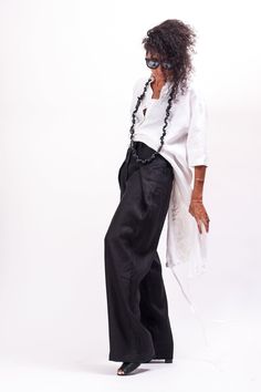 Inspire them all in the Black wide leg linen pants women. These tall Black wide leg linen pants women feature a mid waisted construction with front botton and zipper closure, two pockets. Perfect for work and daily life. This women's trousers feature a men's classic cut with an avant-garde wrapping of the sides around the hips. High rise with a Black wide leg linen pants women, you'll be at your highest comfort level without compromising style. Wear these mid waisted pants women with a flowy cro Versatile Linen Wide Leg Pants, Wide-leg Linen Harem Pants For Work, Black Linen Wide Leg Pants For Summer, Linen Wide Leg Harem Pants For Work, Baggy Wide Leg Linen Pants, Baggy High-waisted Linen Wide Leg Pants, Drop Crotch Pants Women, Women Linen Clothing, Khaki Overalls