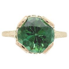 14K yellow gold ring featuring a green tourmaline. The round brilliant cut tourmaline weighs 2.94 carats and measures about 8.2mm. There is hand engraved detail and 4 new prongs. The ring fits a size 5.25 finger, weighs 1.76dwt. and dates from the 1940's. There are some tiny nicks on the stone. Green Tourmaline Ring, Ring Hand, Tourmaline Ring, Ring Fit, Yellow Gold Ring, Green Tourmaline, Jewelry Rings Engagement, Hand Engraving, Yellow Gold Rings