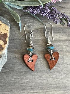 This is a pretty pair of earring using a wood heart and Czech glass beads. Finished with silver plated ear wires. They measure 2 1/4" overall.  #beadedartbyv #beadedearrings #beadedjewelry #HandCraftedJewelry #artisanjewelry #artisanmade #woodhearts #woodearrings Wood Hearts, Oct 11, Wood Earrings, Crafty Stuff, Glass Earrings, Czech Glass Beads, Artisan Jewelry, Ear Wires, Czech Glass