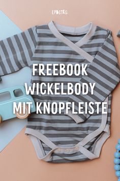 a baby's bodysuit with the words facebook wickelbody mit knopfleiste