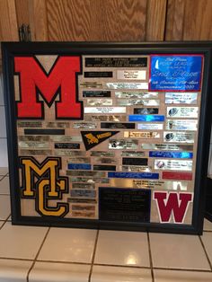 a large framed display with many different sports related items on the front and back of it