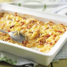 a casserole dish filled with eggs and bacon