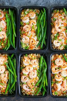 six plastic trays filled with shrimp, rice and veggies covered in sauce