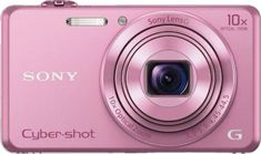 a pink digital camera sitting on top of a table